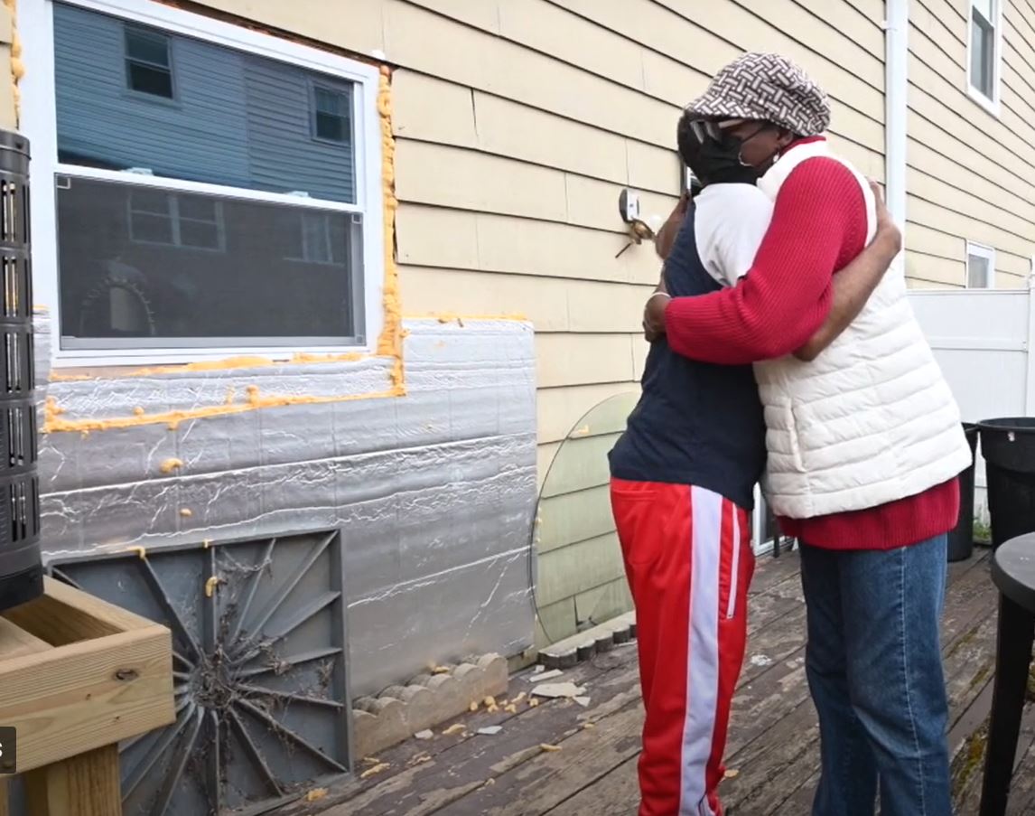 Two people hug in Eastwick