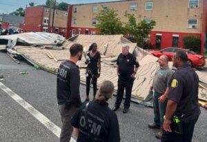 Philadelphia OEM Officers of Emergency Management stand together to assess the storm damage.